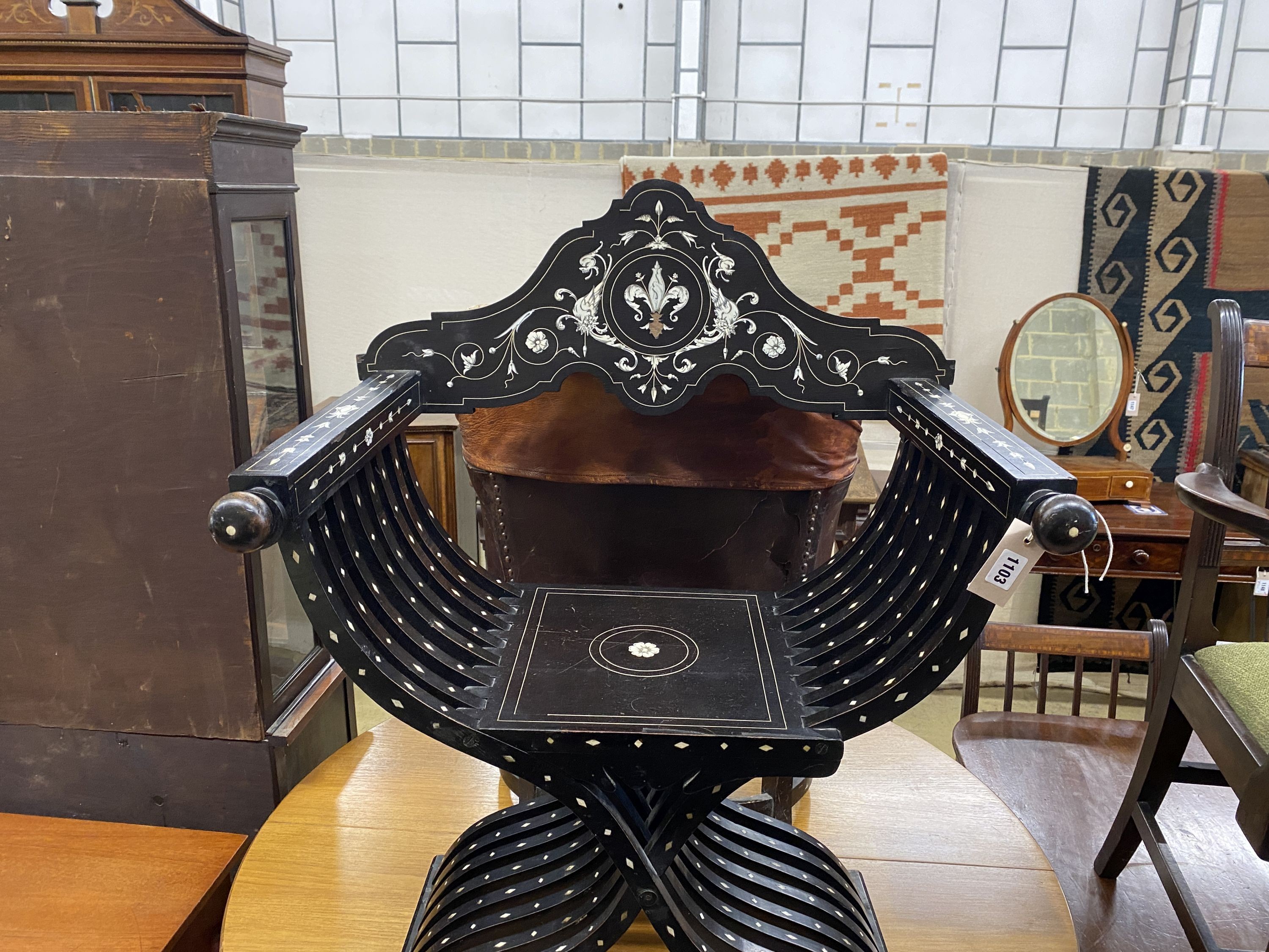 A 19th century Italian ebonised bone inlaid savonarola chair, width 72cm, depth 33cm, height 97cm
